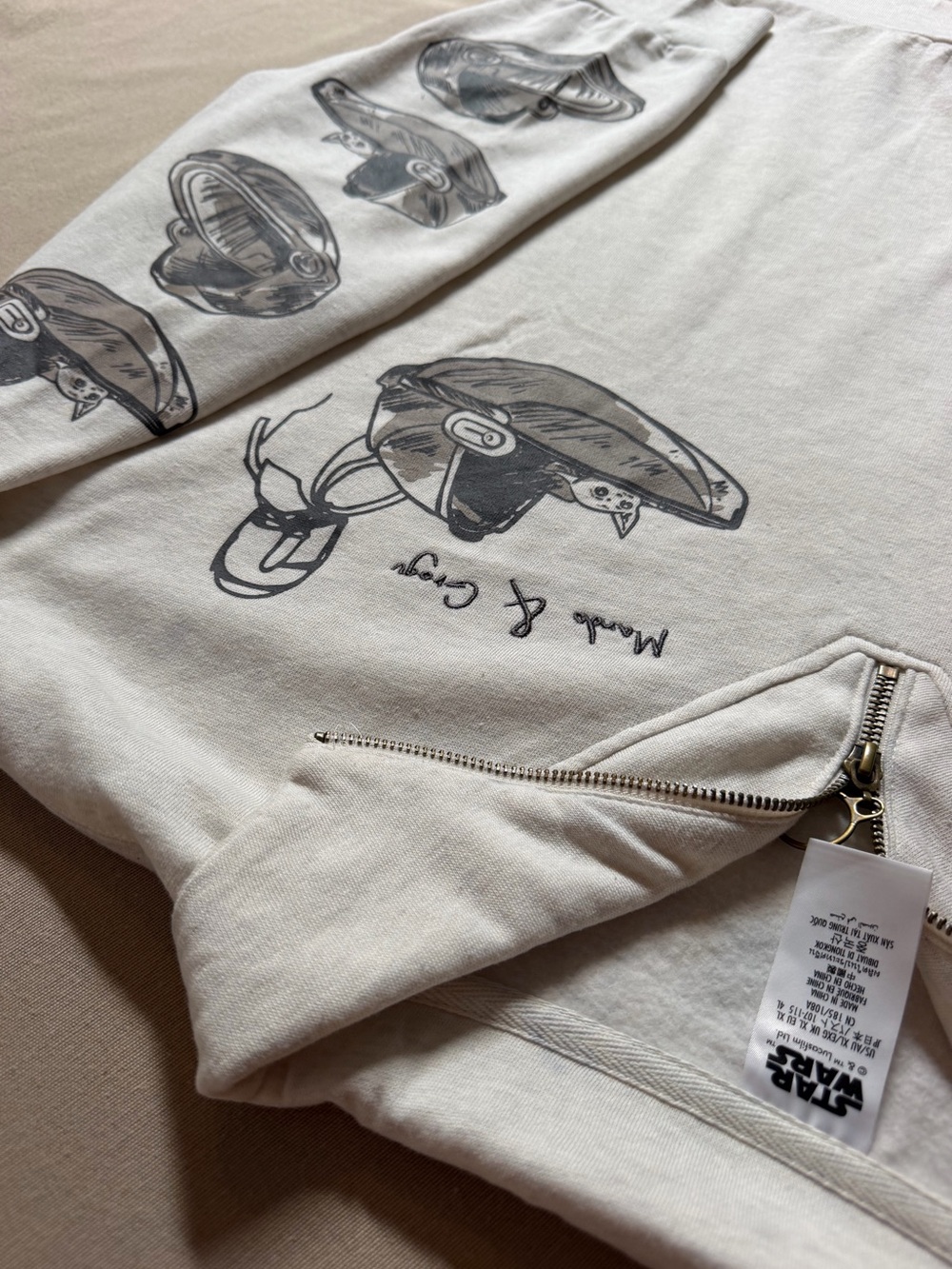 Star Wars Women’s Cream Zip-Up Sweater with Helmet Graphics